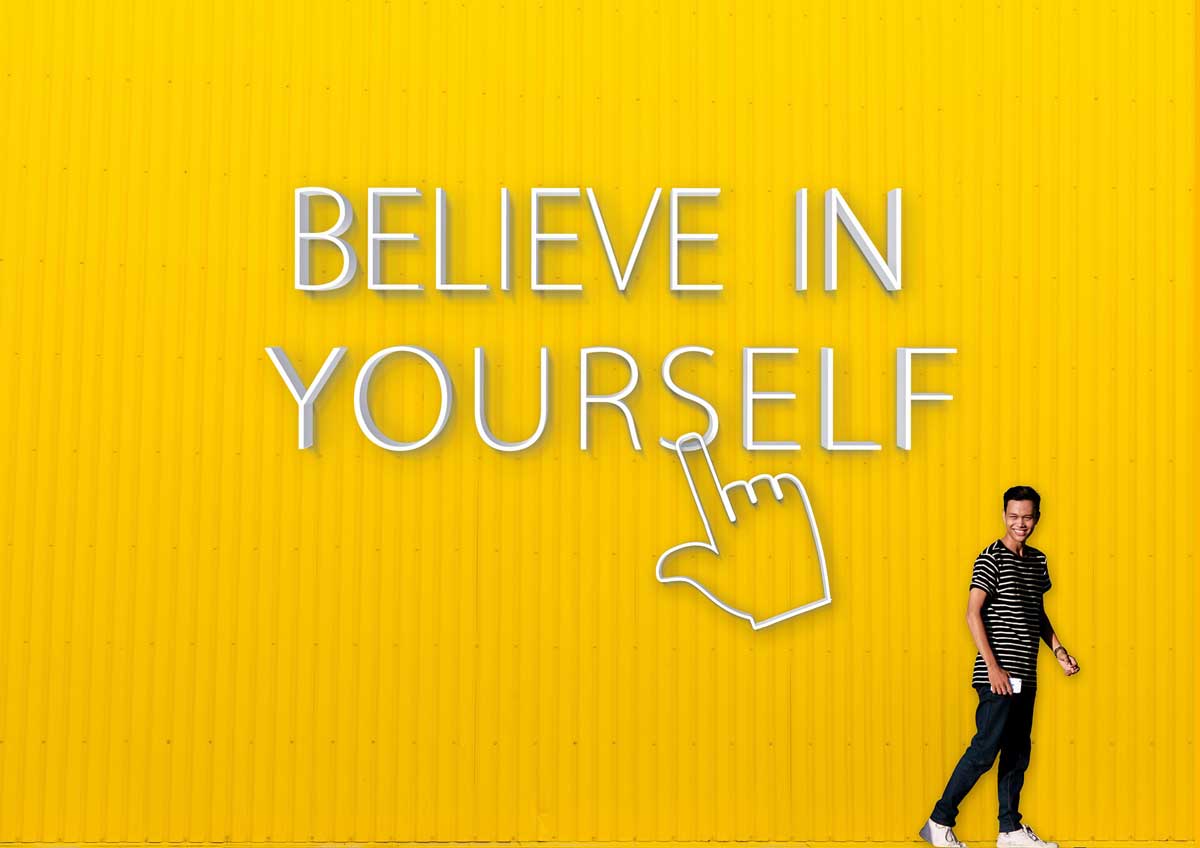 photo of yellow wall says believe in yourself.