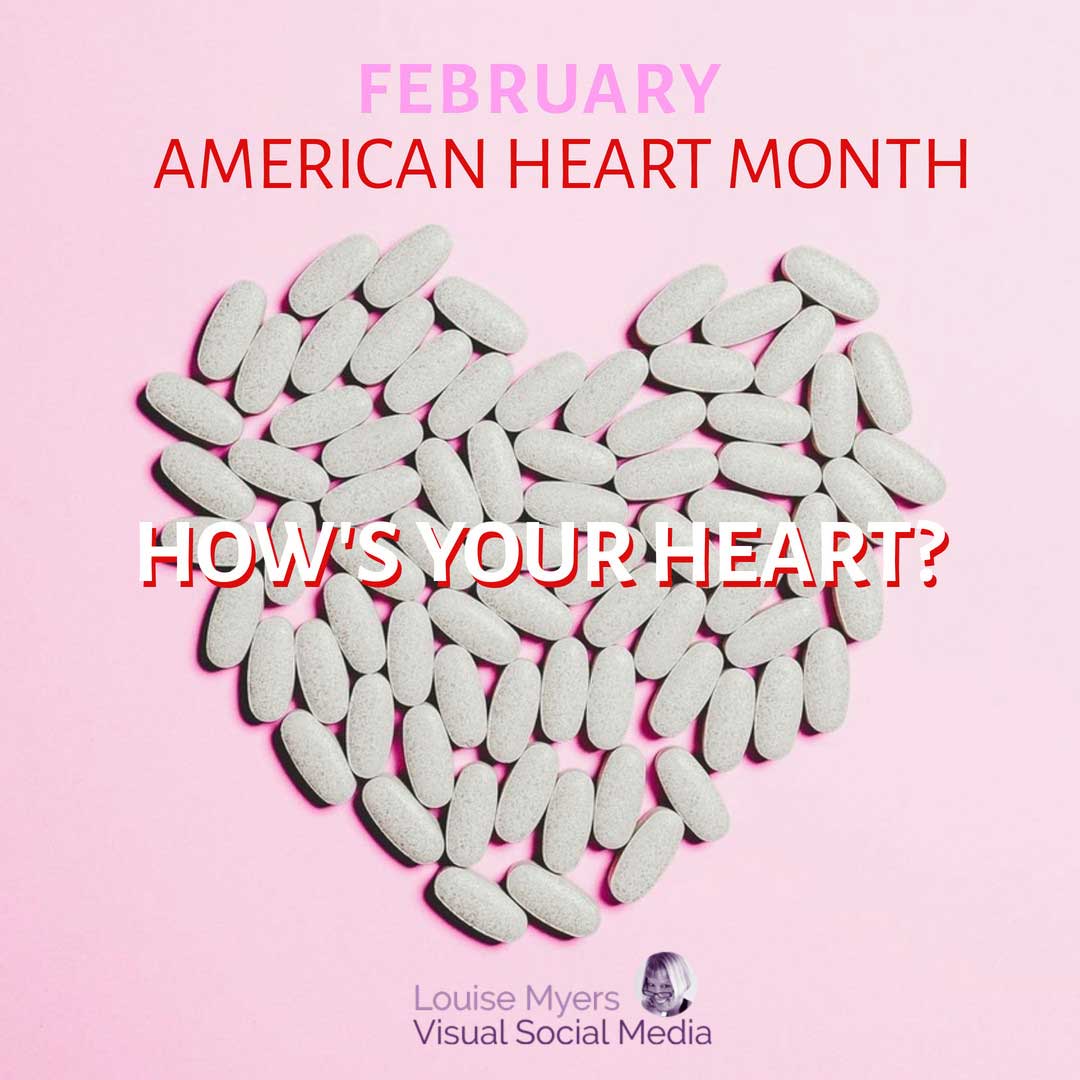 heart made of capsules on pink background says february is american heart month.