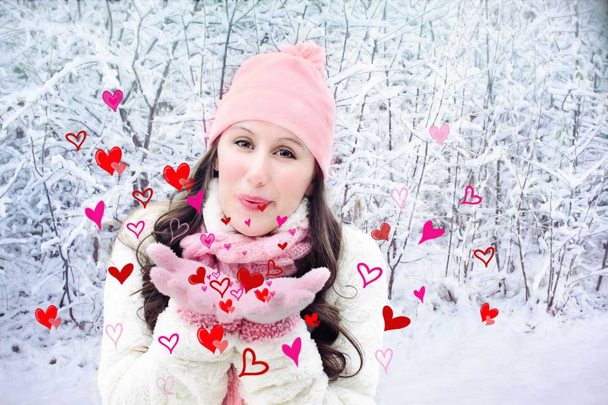 photo of woman blowing valentine hearts.
