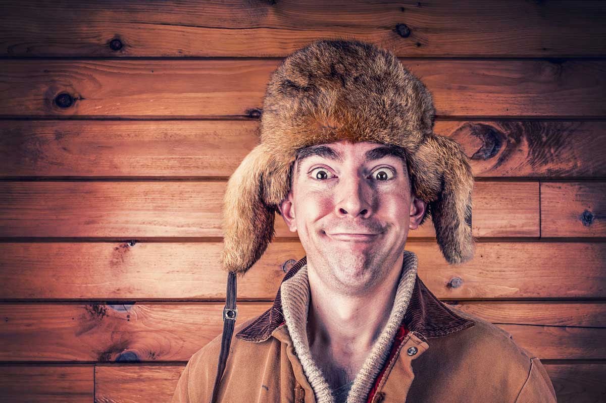 photo of bundled up man with funny face.