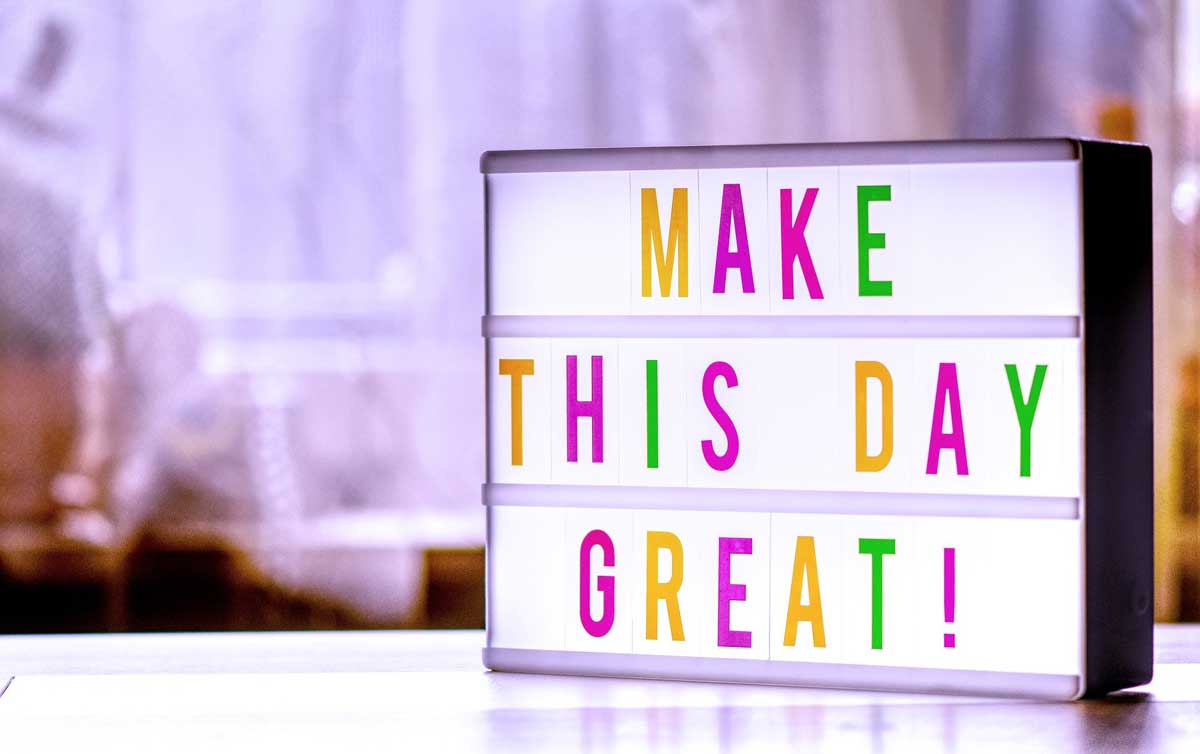 lightbox says make this day great in colorful letters.