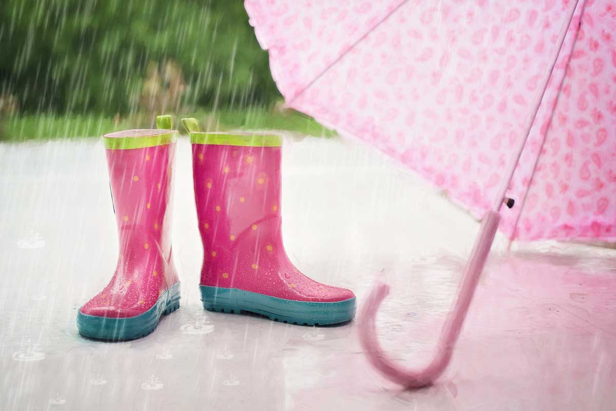 pink rainboots and umbrella in april showers.