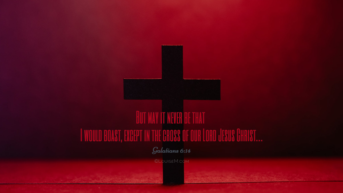 Cruz simple recortada contra un brillo rojo Foto de portada de Facebook que muestra el versículo de Gálatas 6:14.
