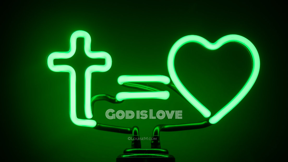 green neon cross, equal sign, and heart says God is love.