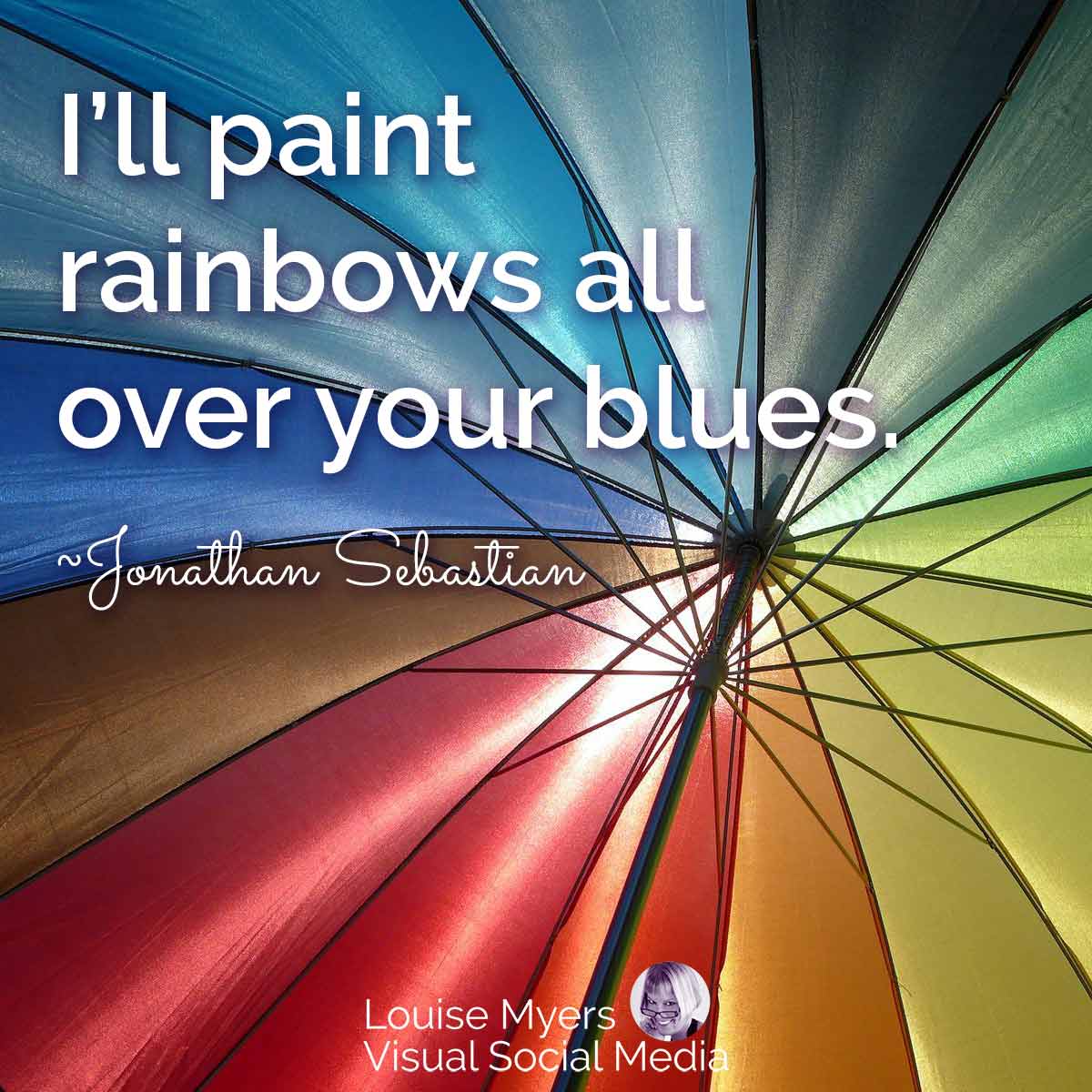 closeup of rainbow umbrella has quote, I’ll paint rainbows all over your blues.