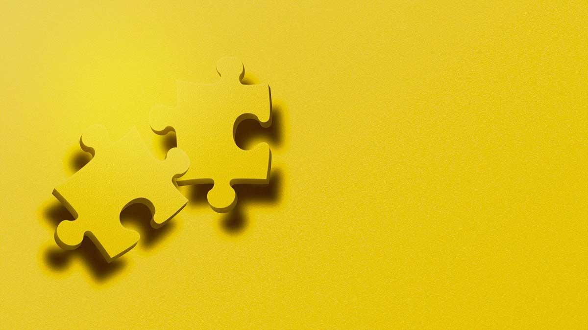 yellow puzzle pieces on yellow background.