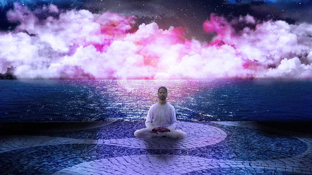 cross legged man meditating on pink path with pink clouds above.