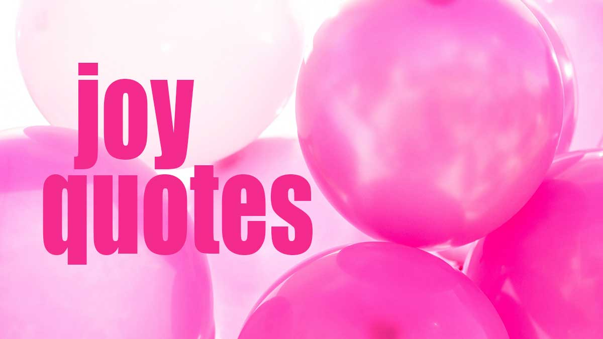 closeup of bright pink balloons with words, joy quotes.