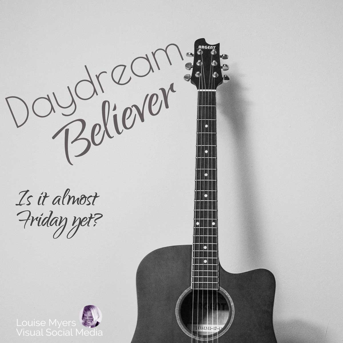 guitar propped against wall has text saying Daydream Believer – is it Friday yet?