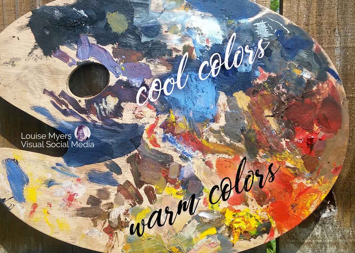 artist palette shows different warm colors of paint vs cool colors.